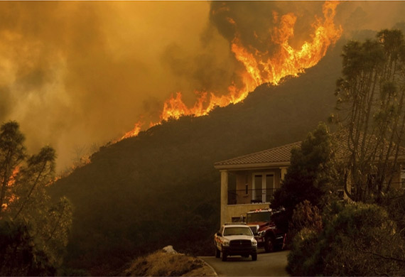 Wildfires rage in Salinas, California on August 17, 2020 [File: AP/Noah Berger]